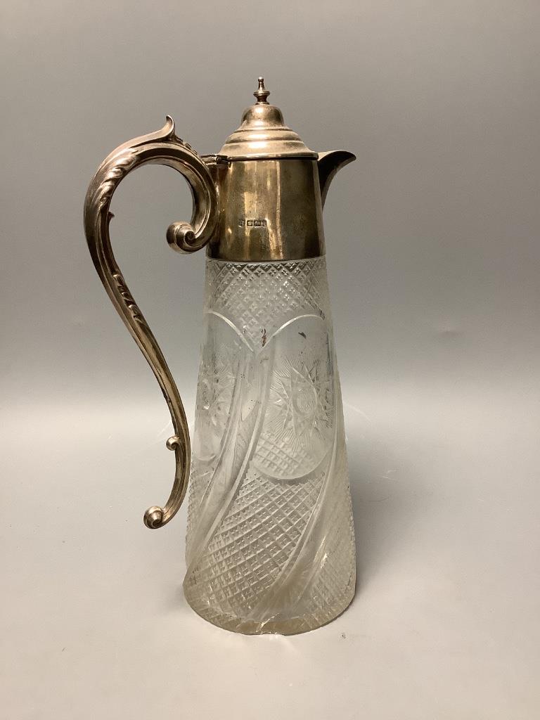 An Edwardian silver mounted cut glass claret jug, James Deakin & Sons Ltd, Sheffield, 1901, height 29.5cm (chipped).